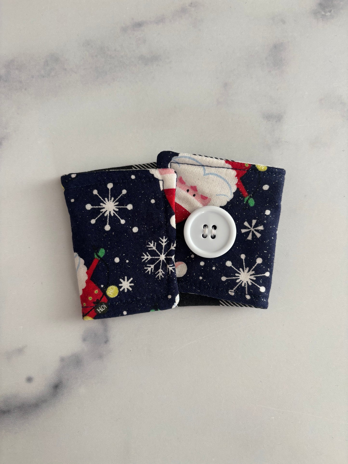 Sparkly Santas on Blue - Reusable Coffee Sleeve