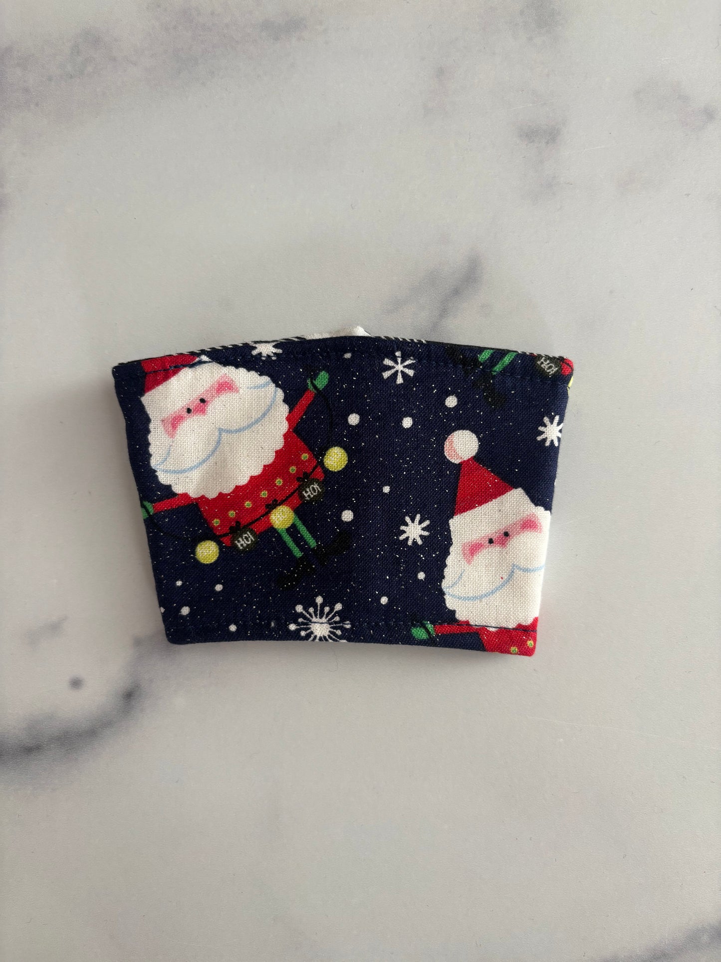 Sparkly Santas on Blue - Reusable Coffee Sleeve