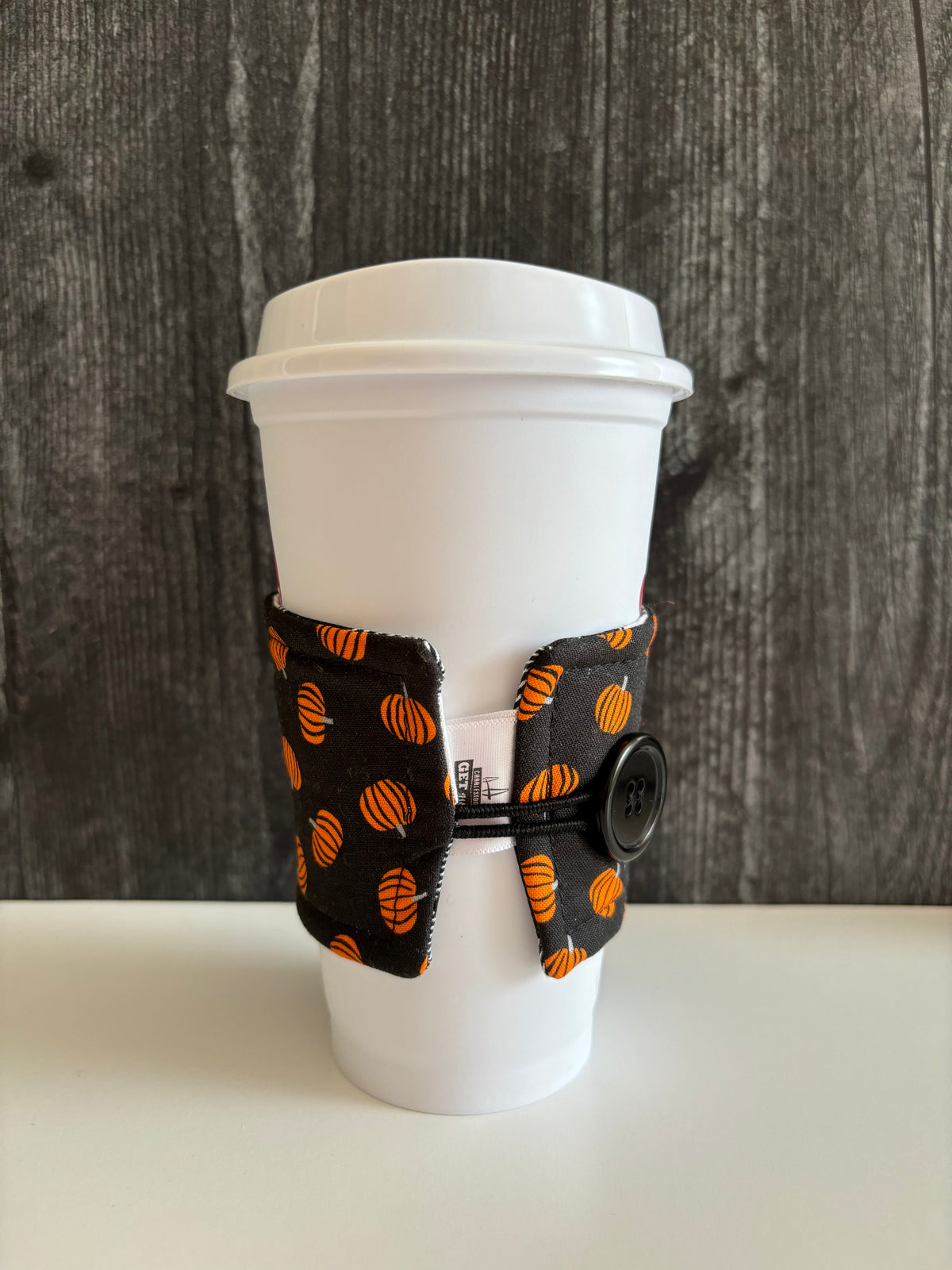 Pumpkins on Black - Reusable Coffee Sleeve