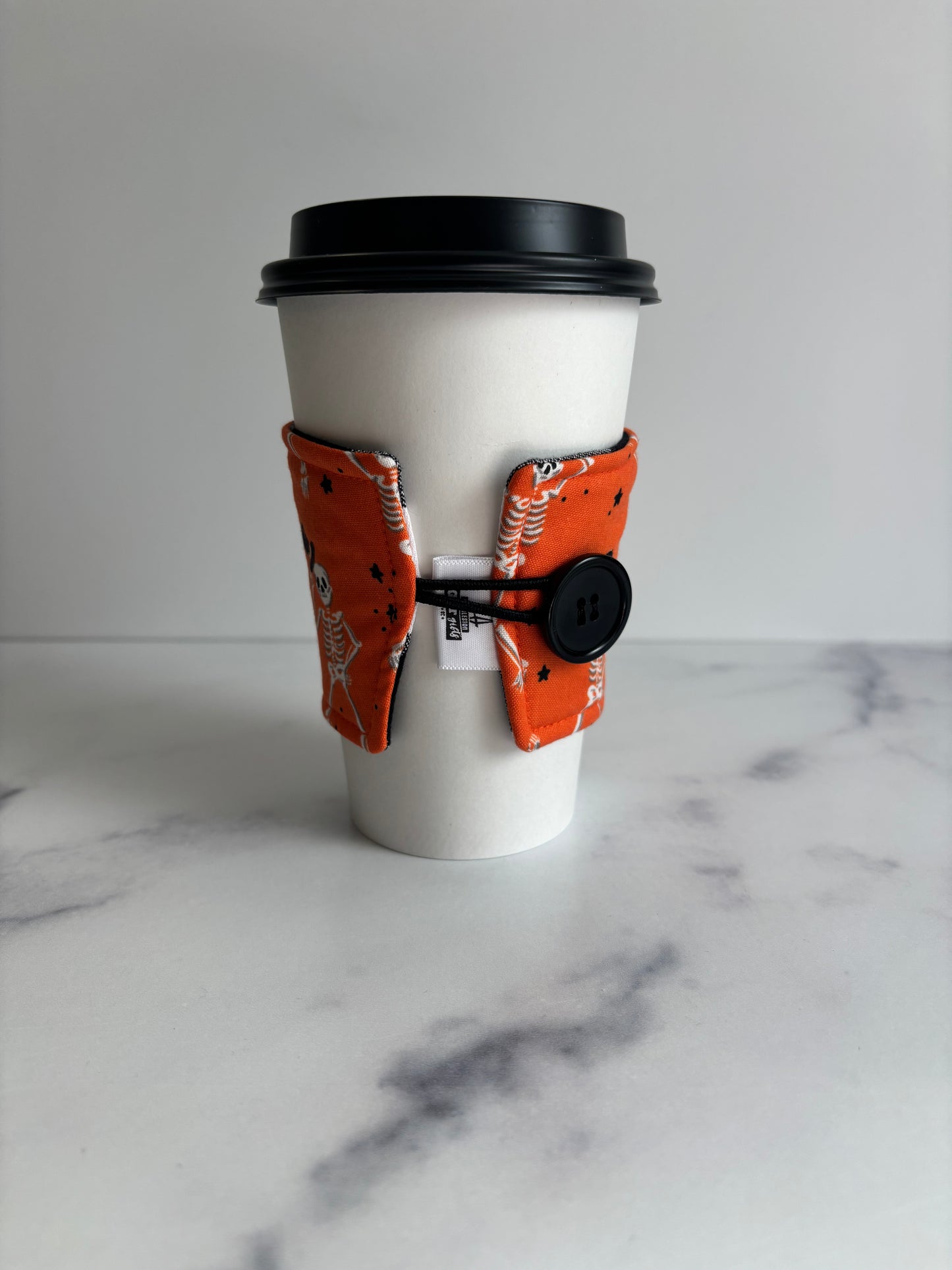 Dancing Skeletons on Orange - Reusable Coffee Sleeve