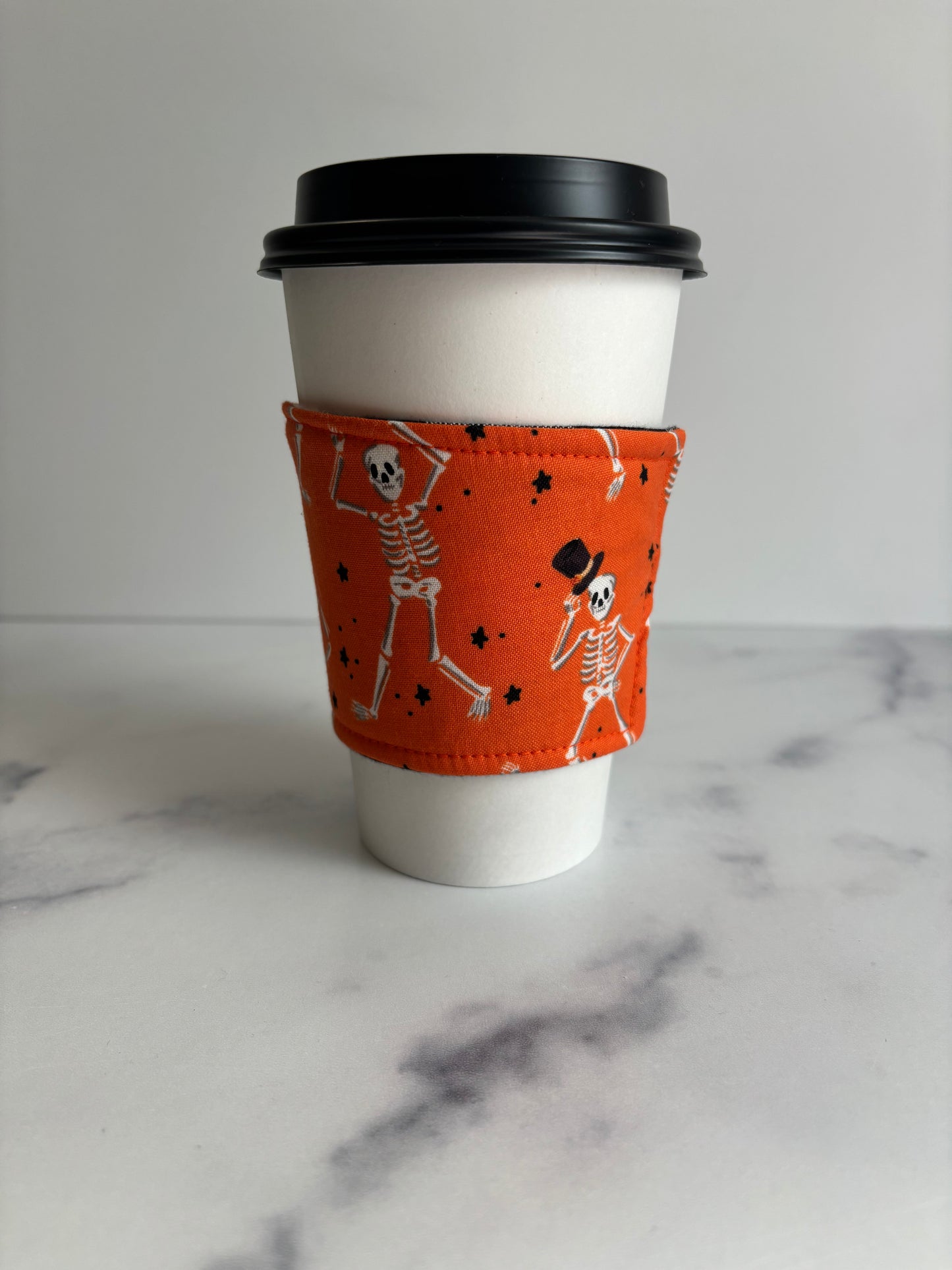 Dancing Skeletons on Orange - Reusable Coffee Sleeve