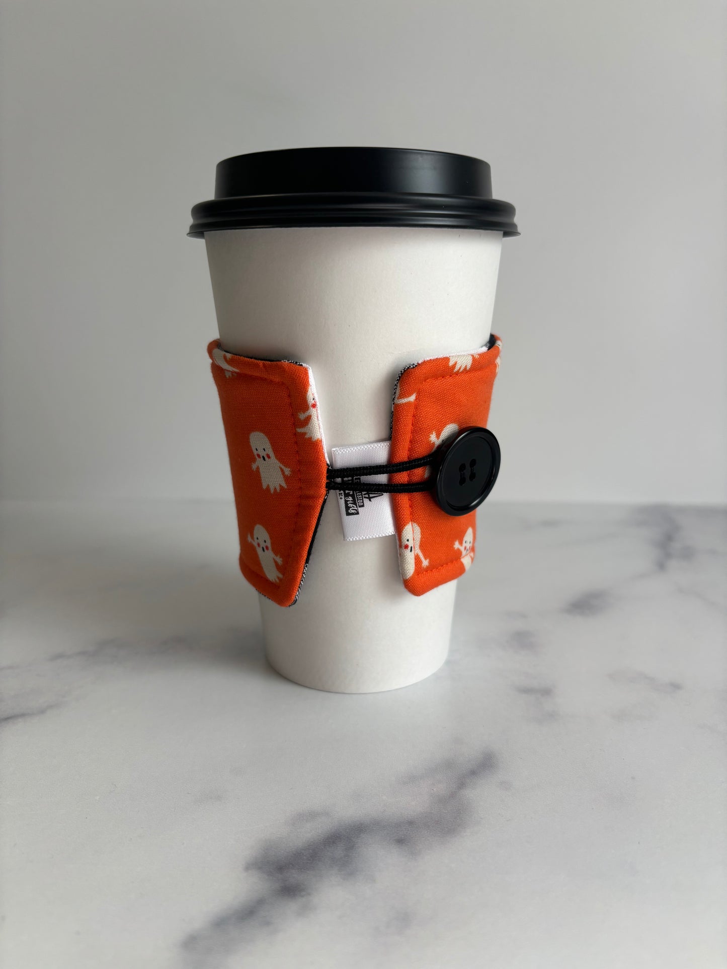 Ghosts on Orange - Reusable Coffee Sleeve