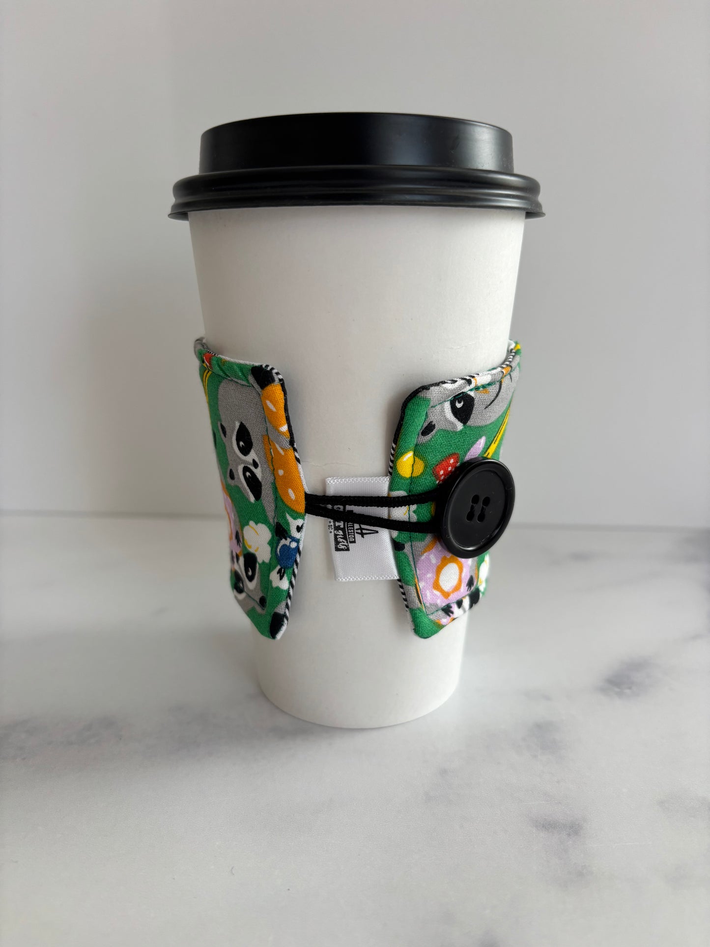 Raccoons on Green - Reusable Coffee Sleeve